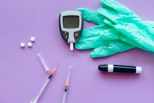 Flat lay of diabetes care tools including glucose meter, syringes, lancet pen, pills, and gloves on purple surface.